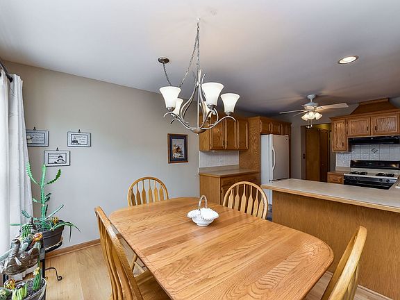 The eating area is generous in size and overlooks the back yard and deck.  There is even room for st