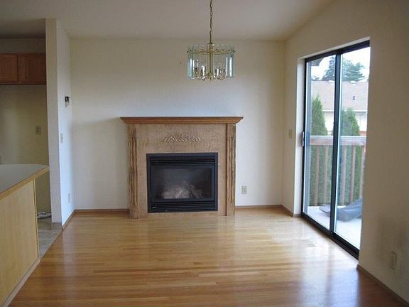 Dining room offers a gas fireplace and slider provides access to the deck