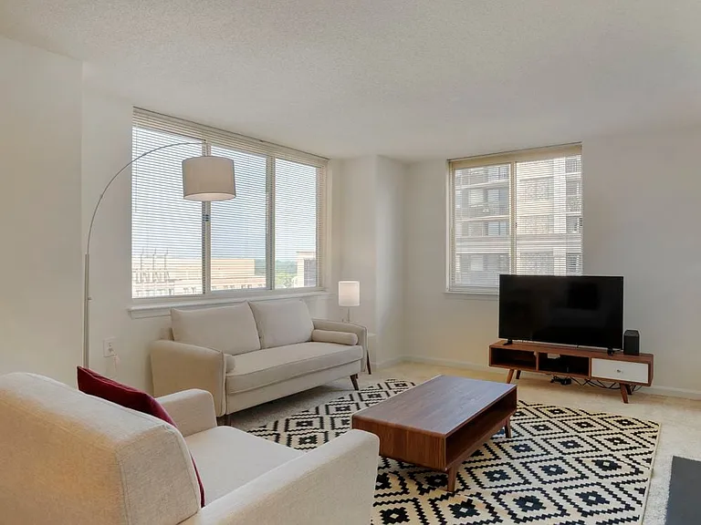 Furnished+ apartment homes come outfitted with a sofa, side chair, side table, coffee table, TV stand and 50" Television (Representative Image exact items and style of furnishings may vary)