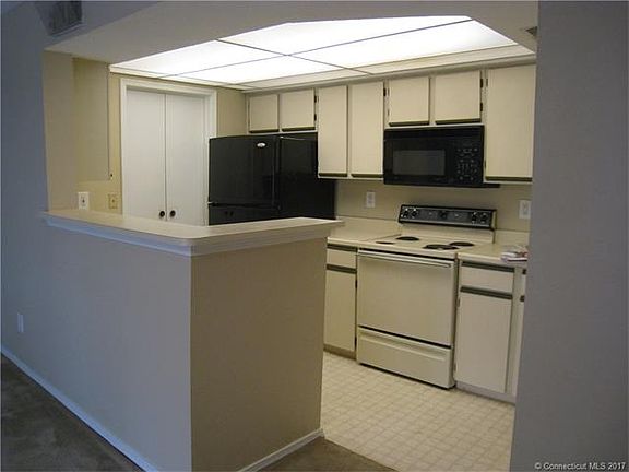 Kitchen with oven range, mi...