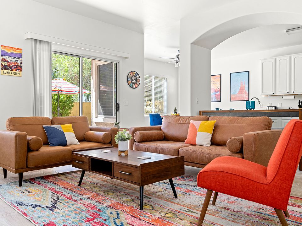 Step into the cozy and colorful living room sanctuary created for relaxation.