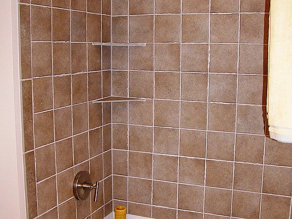 full tile shower and soaking tub.