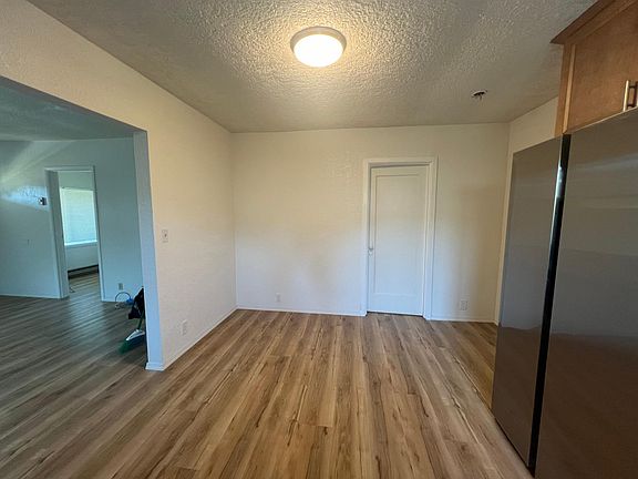 Small dining room area, door to 2nd bedroom.