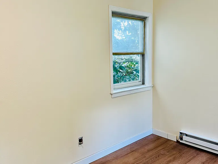 New paint fixtures and flooring in this bedroom