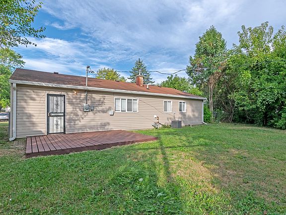 Back of house with deck