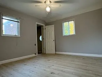 Master bedroom view from different angle - door to the bathroom.