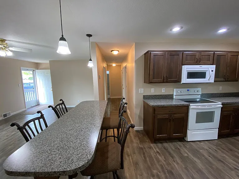 Bar area with a look down 3 bedroom and bath hallway.