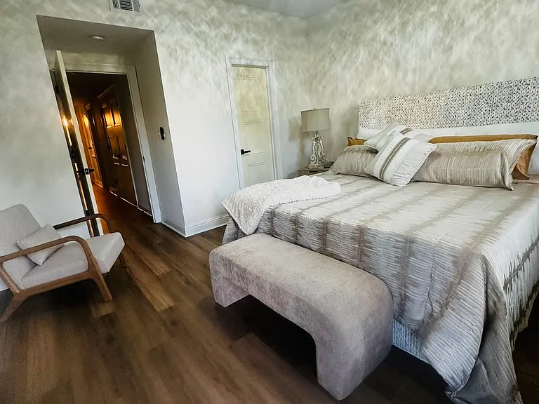 large oversized master ,king bed, walk in closet with insuite bathroom and door access to the back patio and yard. also has a 50 inch tv.