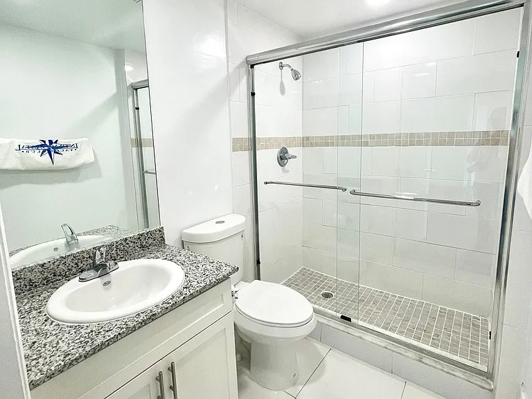 Bathroom with Granite Countertops and Shower with Glass Enclosure
