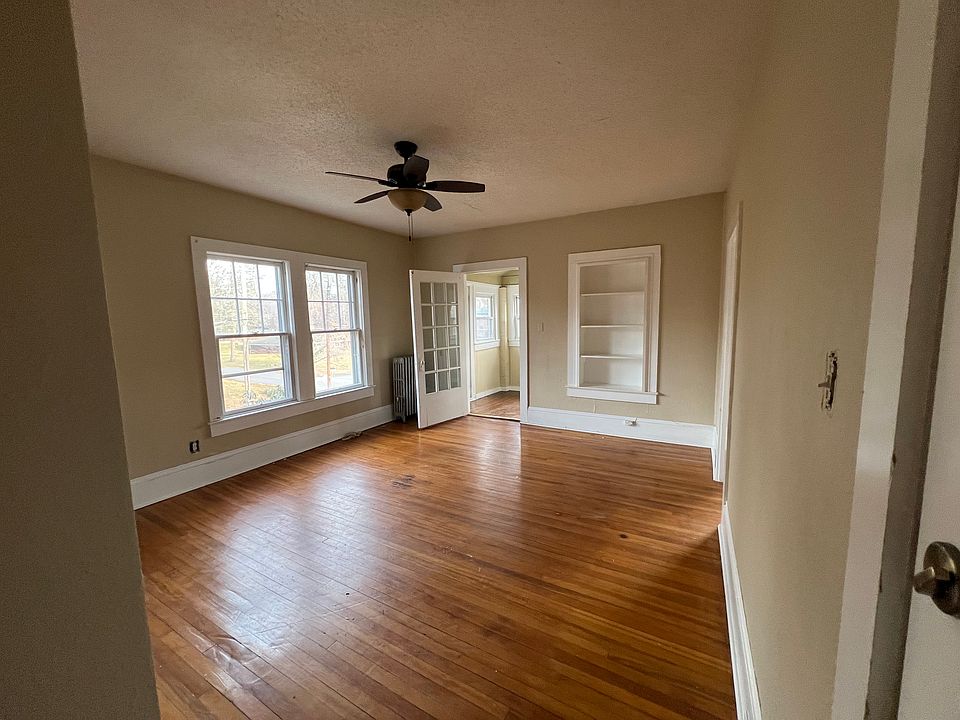 Looking in at the apartments main living area from its second story entry.