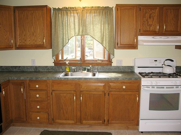 Bright and sunny kitchen with new countertops and flooring.