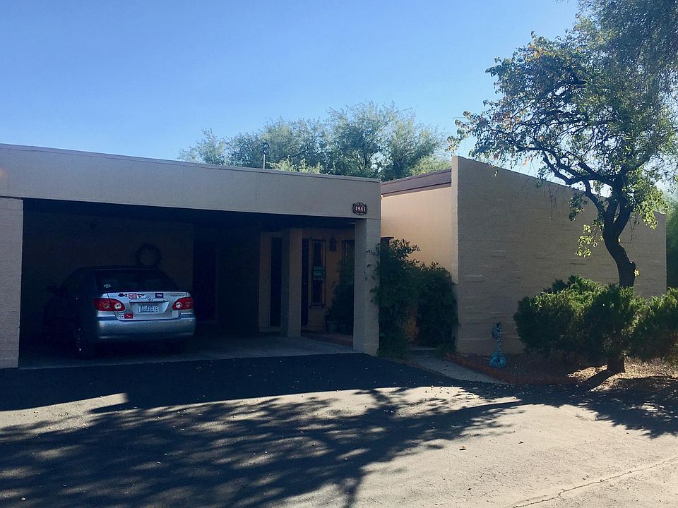 Two car carport with large storage room. Additional street parking in front of townhouse.