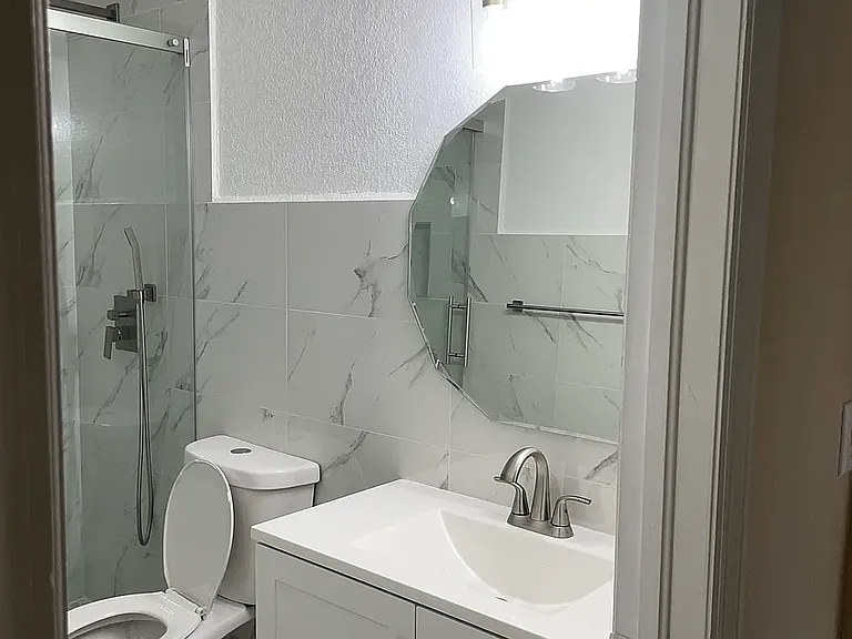This bathroom is in the hall next to bedroom 3.