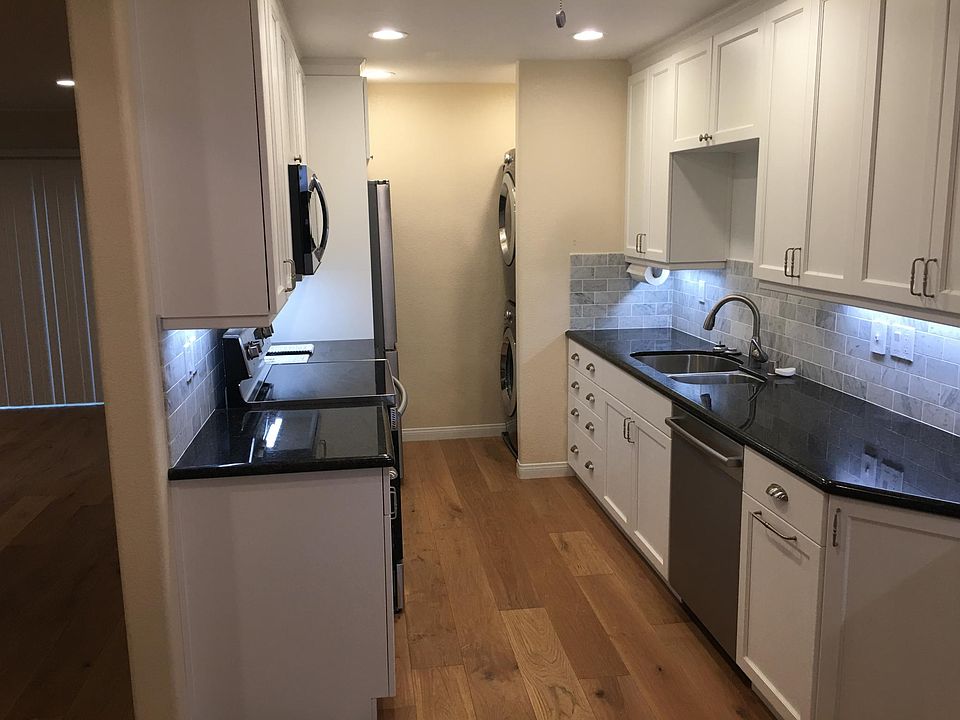 All new kitchen cabinets, granite countertops, stainless steel sink, and real hardwood floor. All new stainless steel high quality appliances including full size stacking washer-dryer. There is ample cabinet space in the kitchen area.
