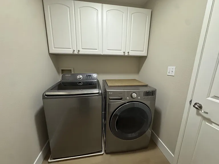 Laundry room with a lot of storage on 2nd floor, next to the kid's bathroom
