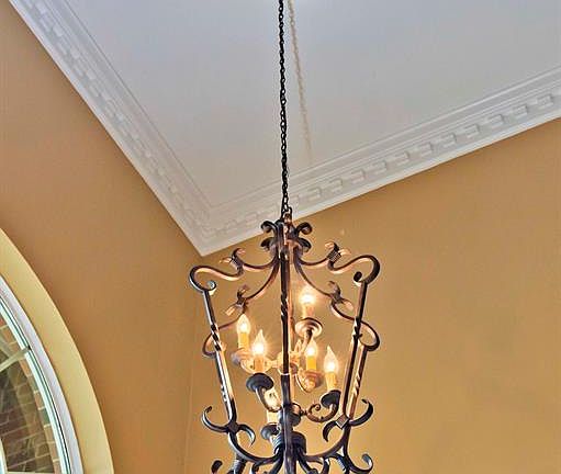 French architecture is the inspiration behind this foyer fixture and it lends itself to any decor. The ceiling medallion adds a bold and beautiful flare.