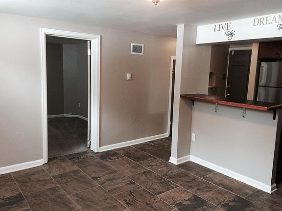 Living room looking towards bedroom and entrance
