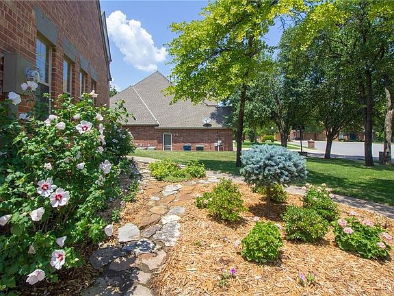 Details are attended to everywhere as shown in this rock walk and maintained garden beds.  Wait until you see it in person!