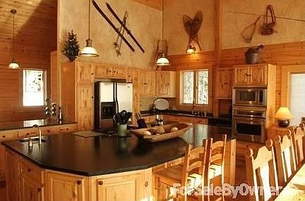 Stone fireplace
						:
						The wood burning fireplace has a fan & built-in space for a flatscreen TV.