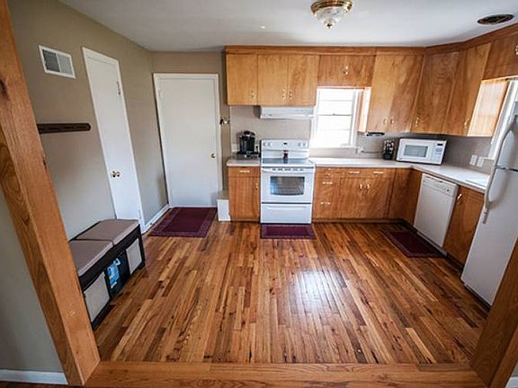 The open concept dining room connects to the functional kitchen (10x14) highlighted by two window views of the front yard which allow natural light to pour into the space.
