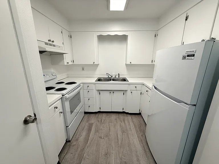 White kitchen with an electric range