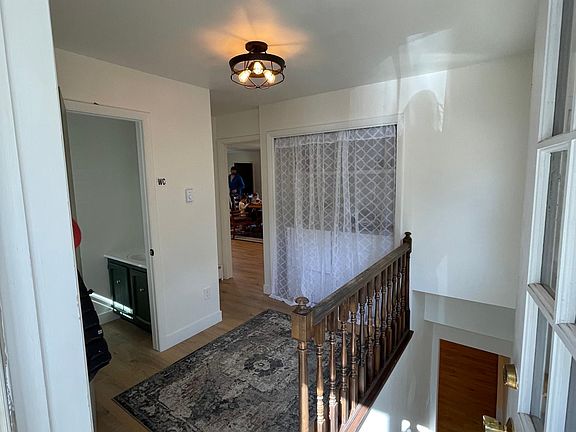 Mudroom with main-level laundry and half bathroom