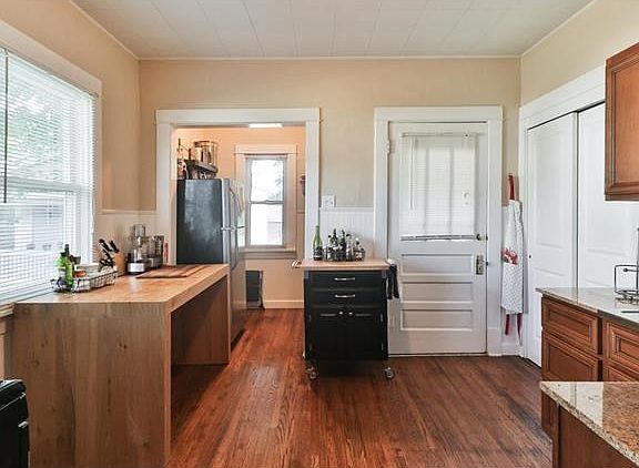 The kitchen is in the rear of the home, just on the other side of the dining room. A full pantry clo