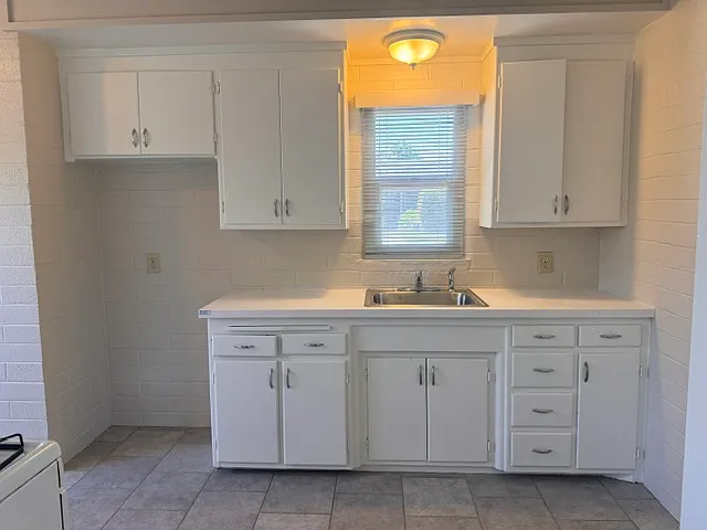 Kitchen receintly updated with new counter top, sink and faucet.