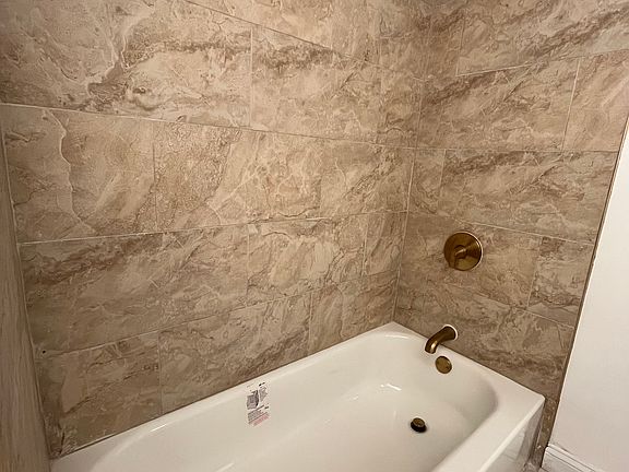 New bathroom (New bath tub, new shower head, new faucets, new tile in bathroom)
