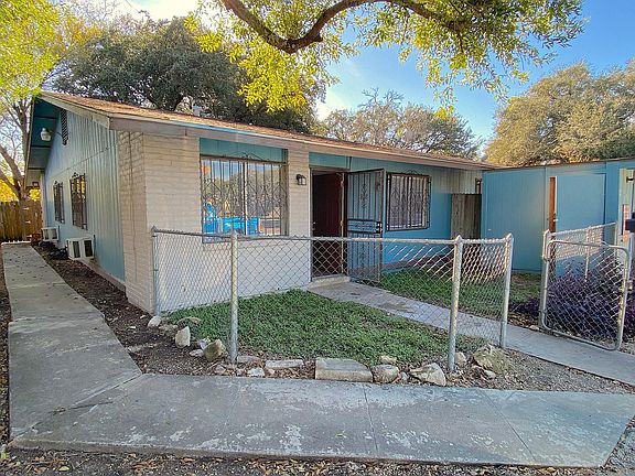 Fenced yard with storage shed