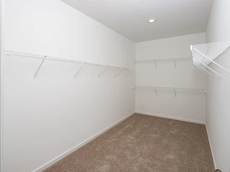 Full size walk in closet in the primary suite.