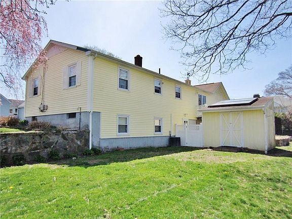 Nice Size Yard with Sprinkler System & Big Shed!