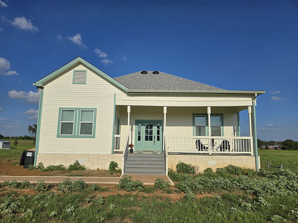 1026 Whisper sits in the middle of 4 acres with pretty views off of the front porch and the back porch.