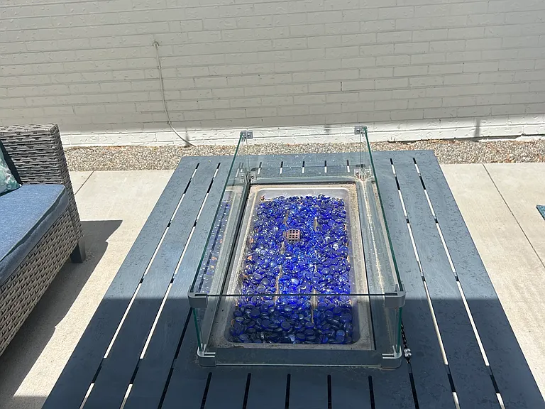 Gas fire pit on side patio