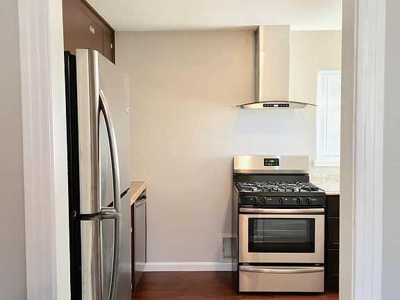 Stay connected to your guests while preparing meals in this functional kitchen
