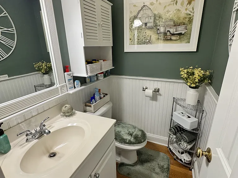 Half bath between kitchen and dining room.