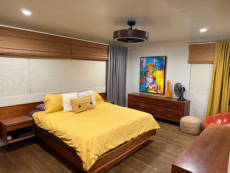 Primary bedroom with dual dressers