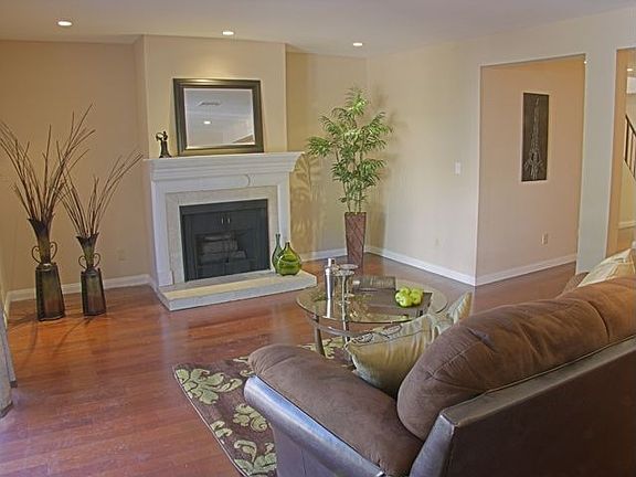 Gas fireplace with an impressive mantel and recessed lights