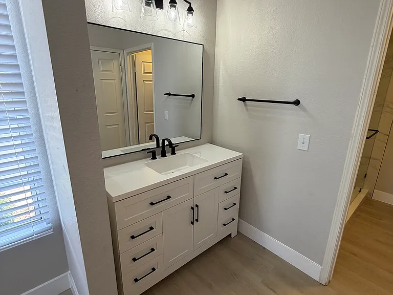 MB. New vanity, mirror, medicine cabinet, mirror and lighting and new flooring