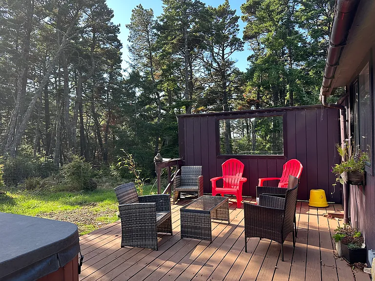 Wonderful wind-protected deck and fully fenced yard area with irrigation and beautiful flower beds plus two beds ready for planting your fall garden.