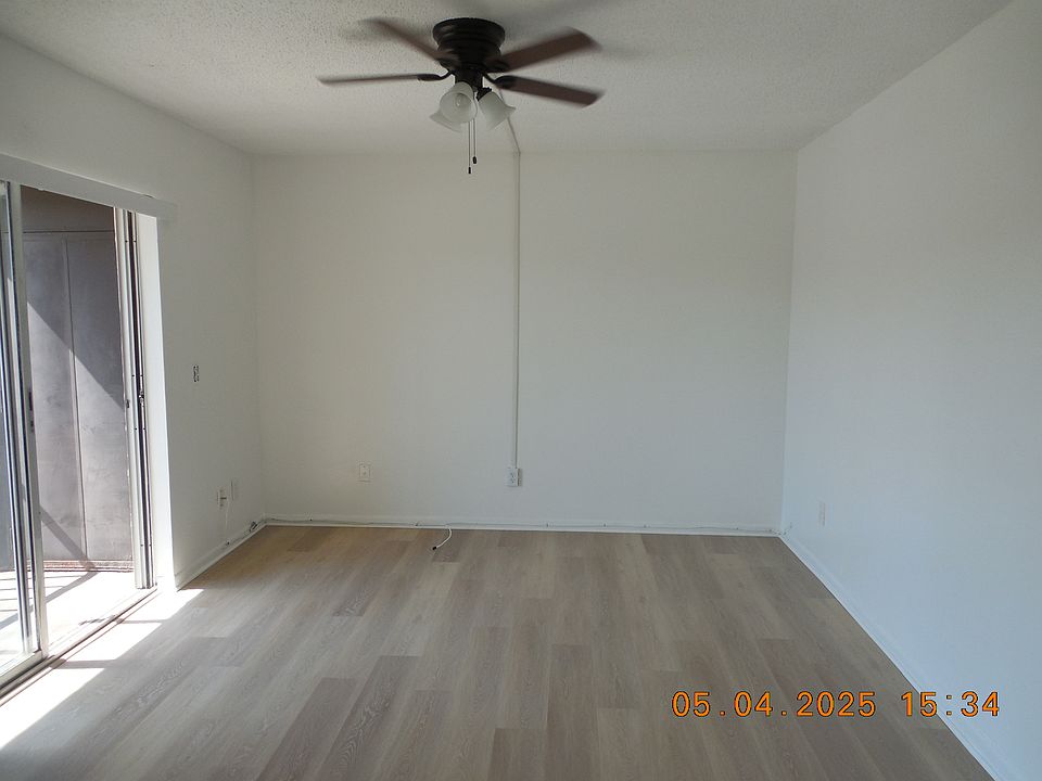 LIVING ROOM. SCREENED IN PATIO WITH PRIVACY BLIND PROVIDED