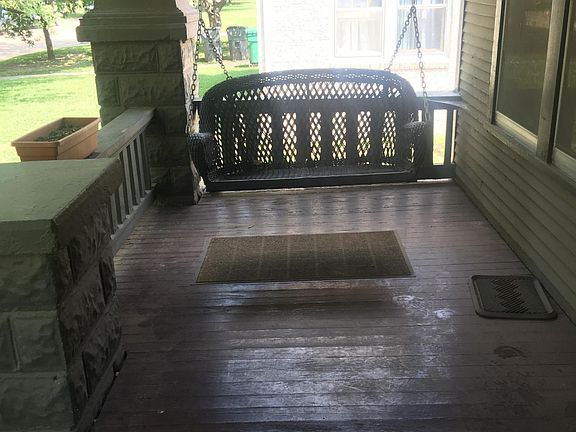 Front porch with swing (north side).