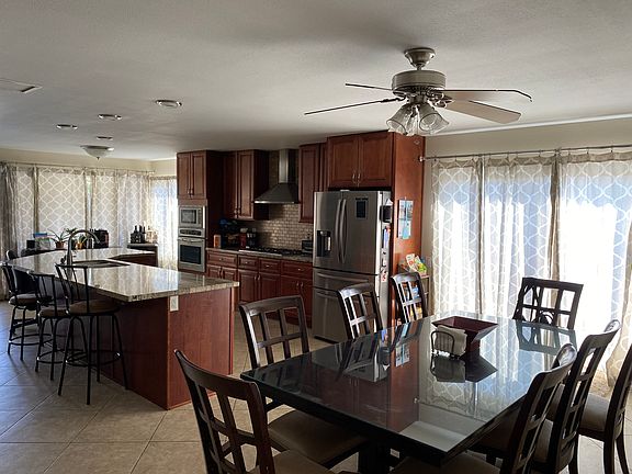 Kitchen island looks into great room/dining room