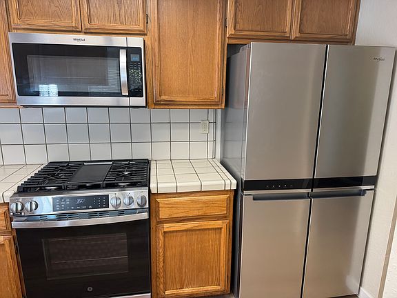 Kitchen with New Refrigerator and Stove