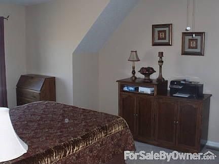 guest bedroom : large room with vaulted ceiling; could be used for office space; overlooks pool