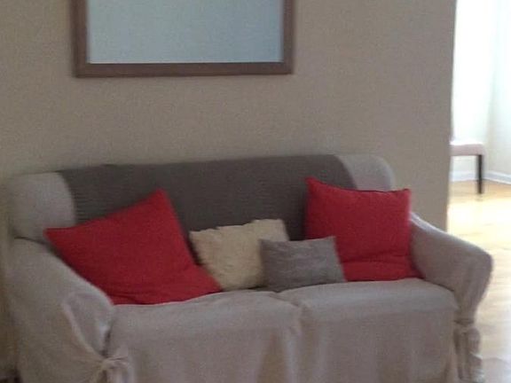 living area, facing towards the dining are and kitchen