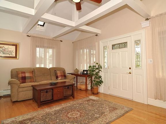 Living Room with Skylights and Oak Flooring
