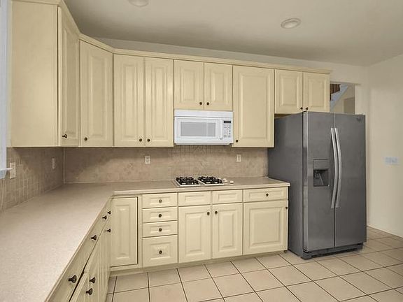 Kitchen with view of entrance to Living Room