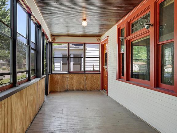 Three season front porch spans length of house