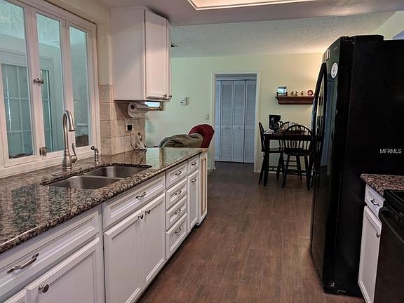 Beautiful Kitchen updates, wood look Tile flooring to the guest area